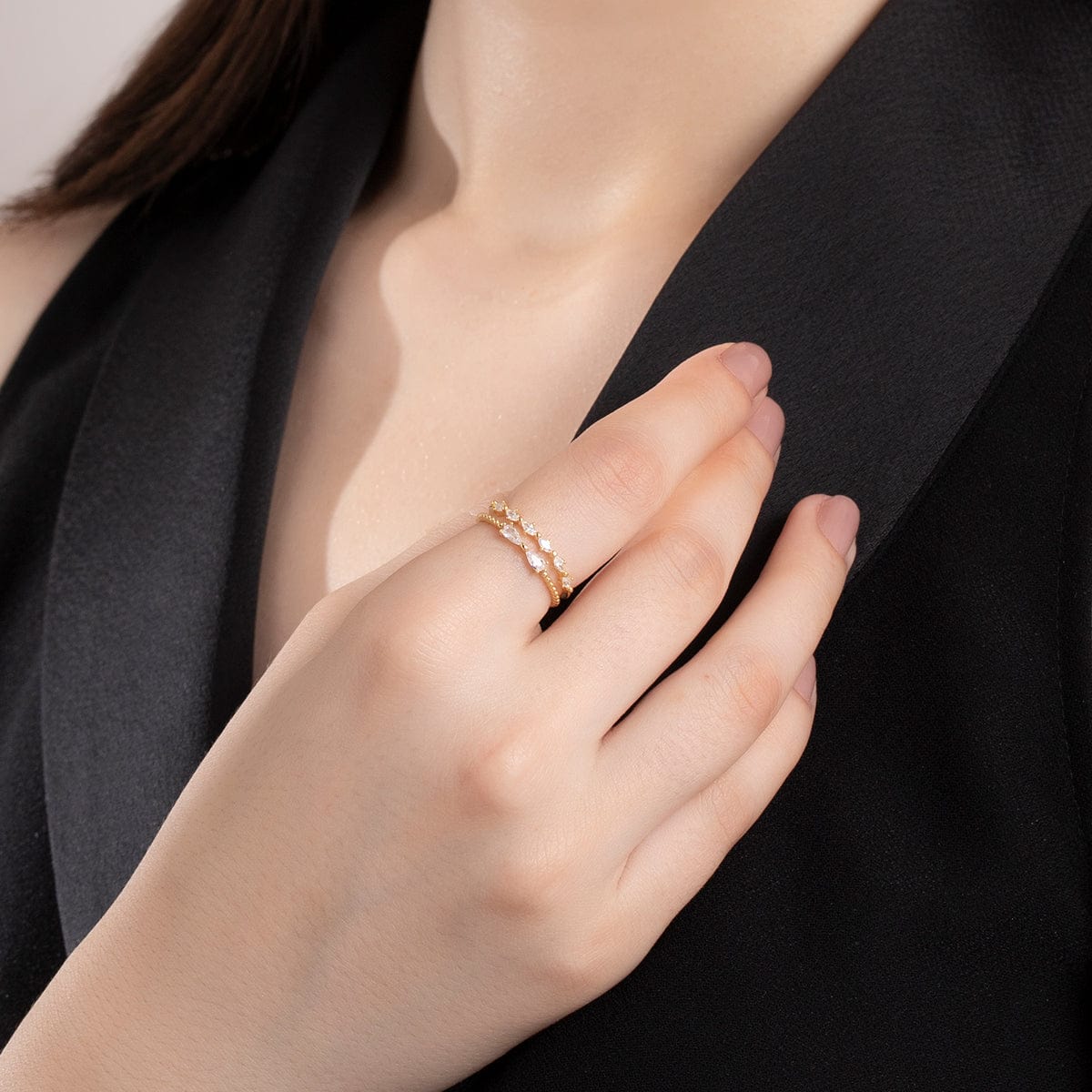 Hand wearing elegant silver ring in oriental shape of om Stock Photo - Alamy